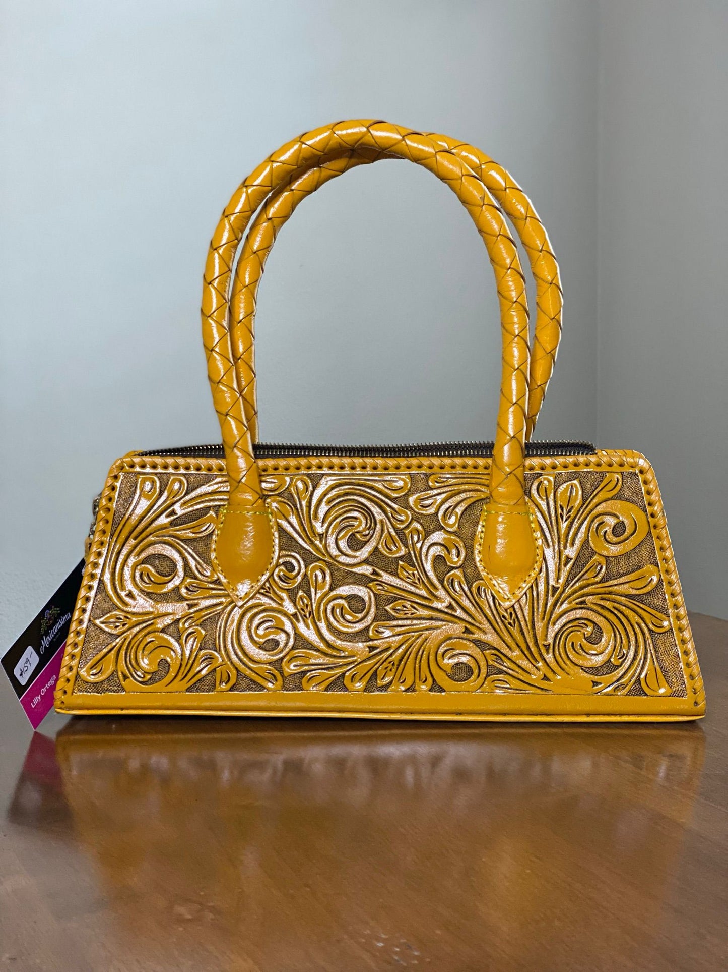 Yellow hand-chiseled leather purse